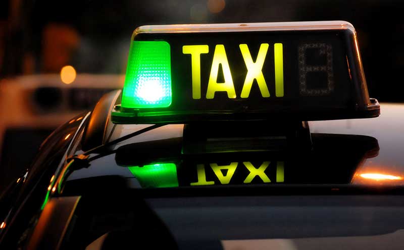 Drunk taxi driver charged after passengers call for help