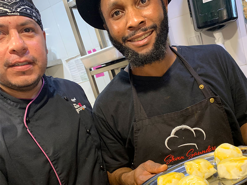 Raul, sous chef, and Prince, head chef, glazing the Wellingtons.