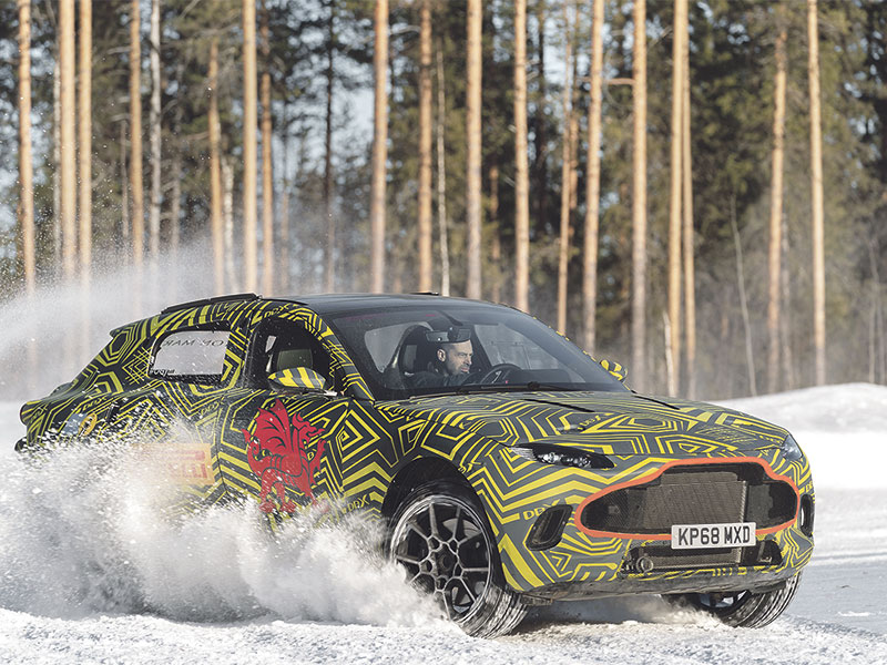 Aston Martin DBX prototype in camouflage paint in Sweden for winter testing.
