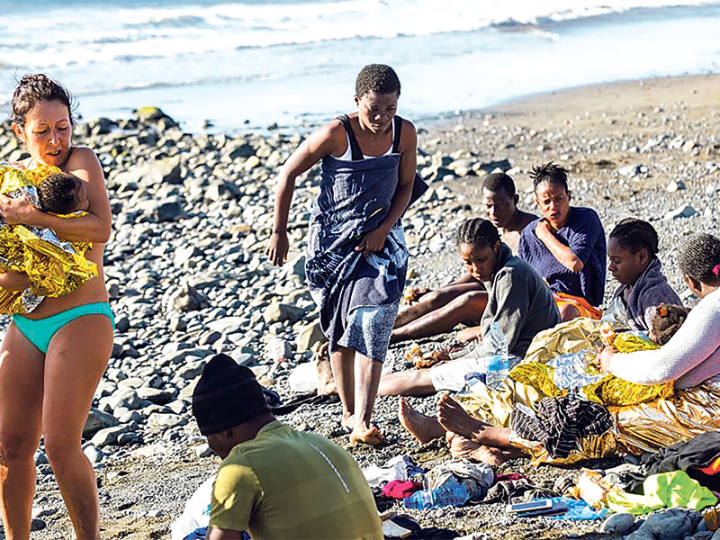 AFRICANS ARRIVE: People on the beach ran and swam out to help.