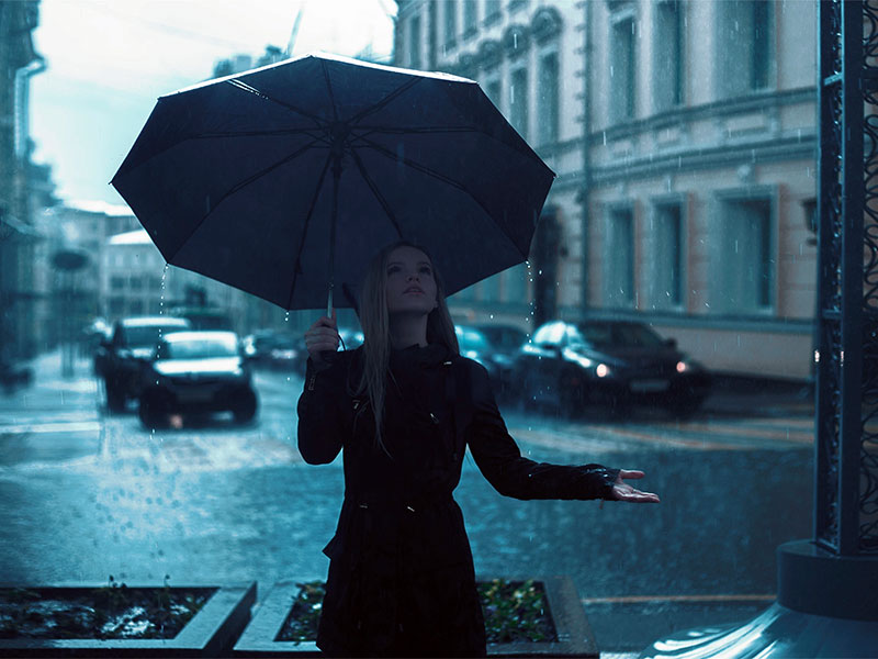 Woman Holding Umbrella