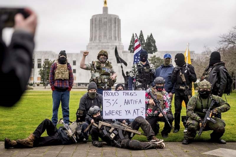 Armed Protesters Gather At Heavily Fortified American State Capitols