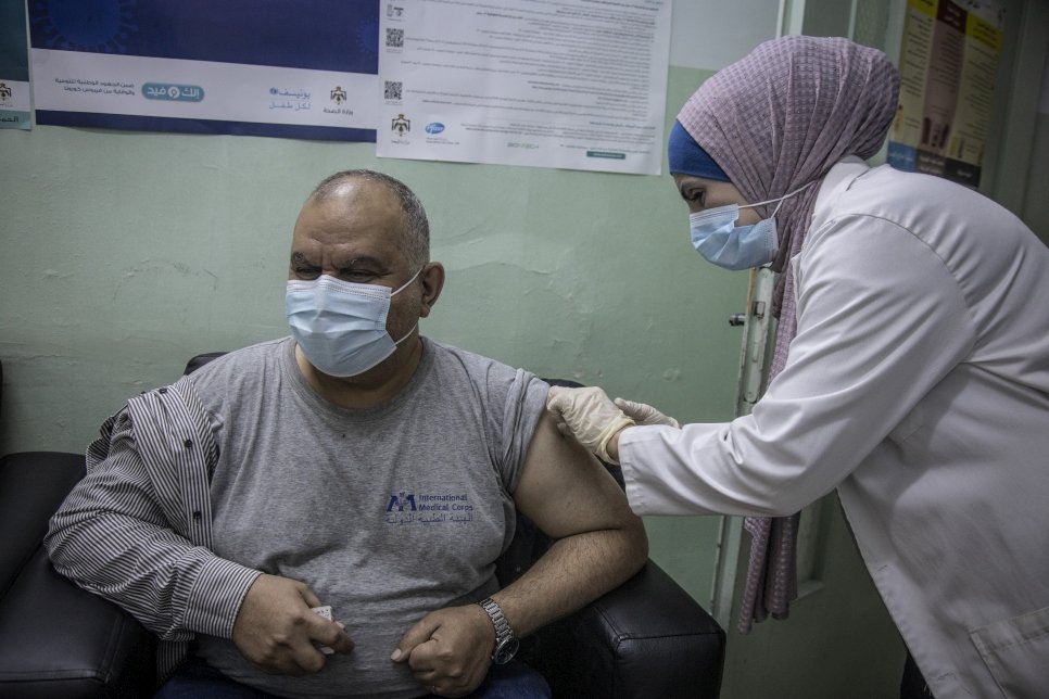Refugees receive Covid vaccinations in Jordan in a world first