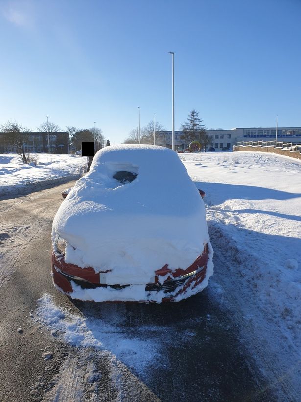 Police Stunned To See Virtually Blinded Snow-Covered Car Driving Through The Streets