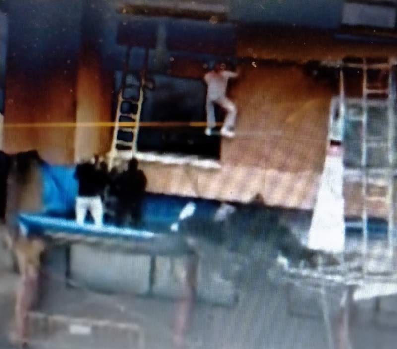 Workmen left hanging from building after scaffolding collapses