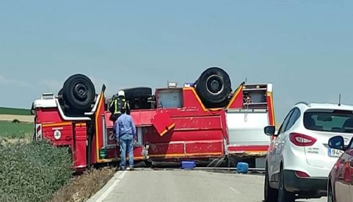 Sevilla Fire Engine Racing To A Fire Overturns In The Road