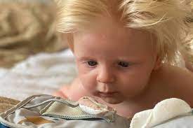 Baby born with full head of blond hair looks like a mini Boris Johnson