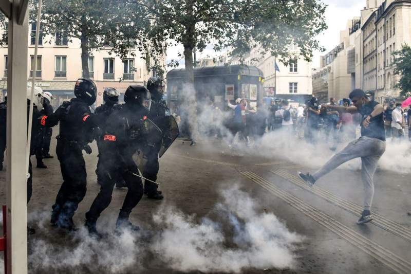 French police clash with thousands of anti-virus pass protesters in Paris