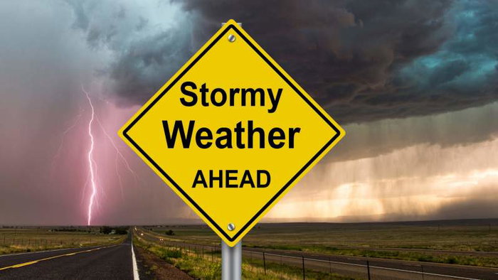 Image of sign warning of stormy weather.