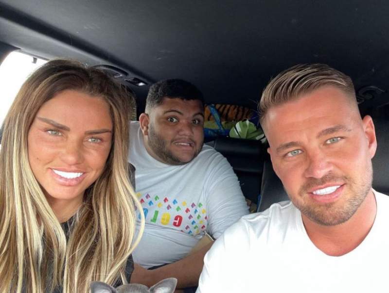 Katie Price’s son Harvey gives her fiance Carl Woods the finger