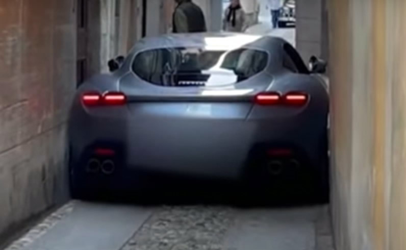 Ferrari Roma supercar wedged in a narrow Italian street