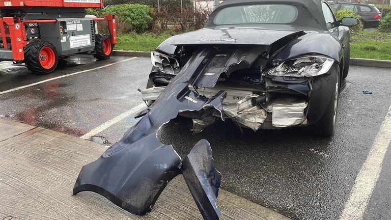 Severely damaged Porsche driven for miles on M25 , Cobham, Surrey, Kent