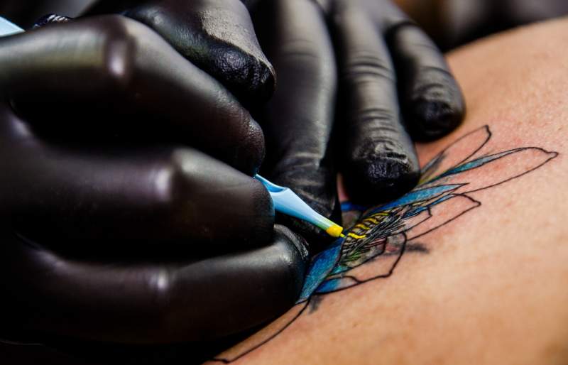 Tattoo artists in the EU will not be allowed to use coloured ink as of next month.