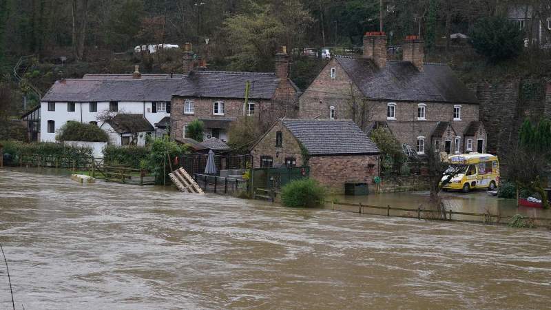 UK weather: River bursts banks, homes evacuated and trains are cancelled, River Severn, River Don,