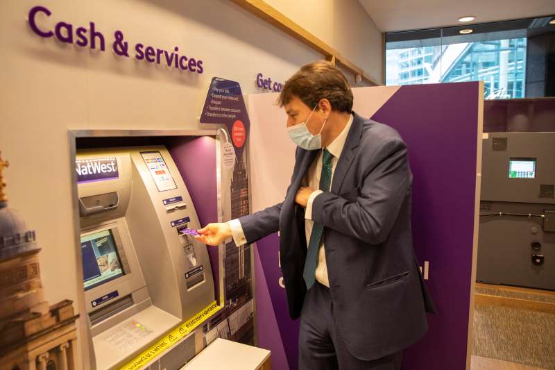 John Glen using a NatWest cash machine