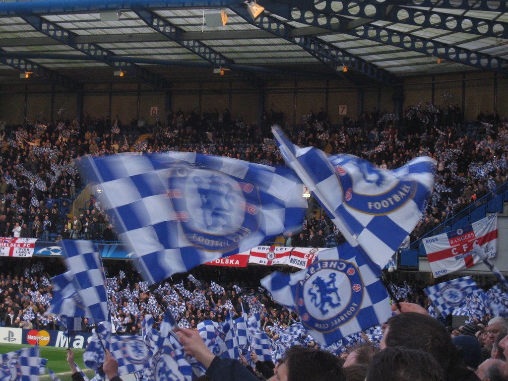 Chelsea fans celebrating at Stamford Bridge.