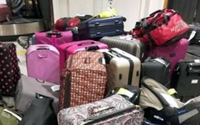 Chaos at Manchester airport as passengers abandon luggage