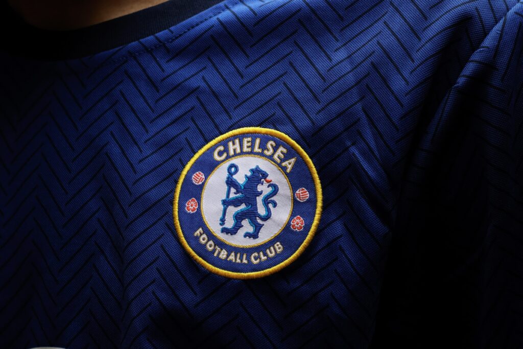Close up of Chelsea's badge on their home kit.
