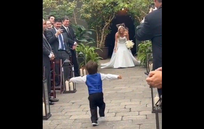 WATCH: Most adorable ring bearer greets his mum at her wedding