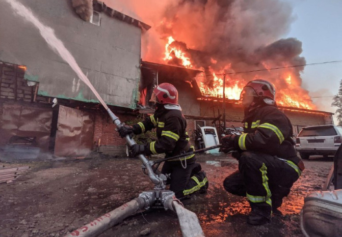 98 people evacuated after huge fire rips through a hotel in the Ukraine's capital Kyiv