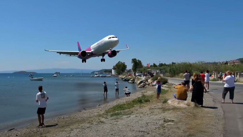 WATCH: Breathtaking moment when aeroplane skims beachgoers heads as it lands