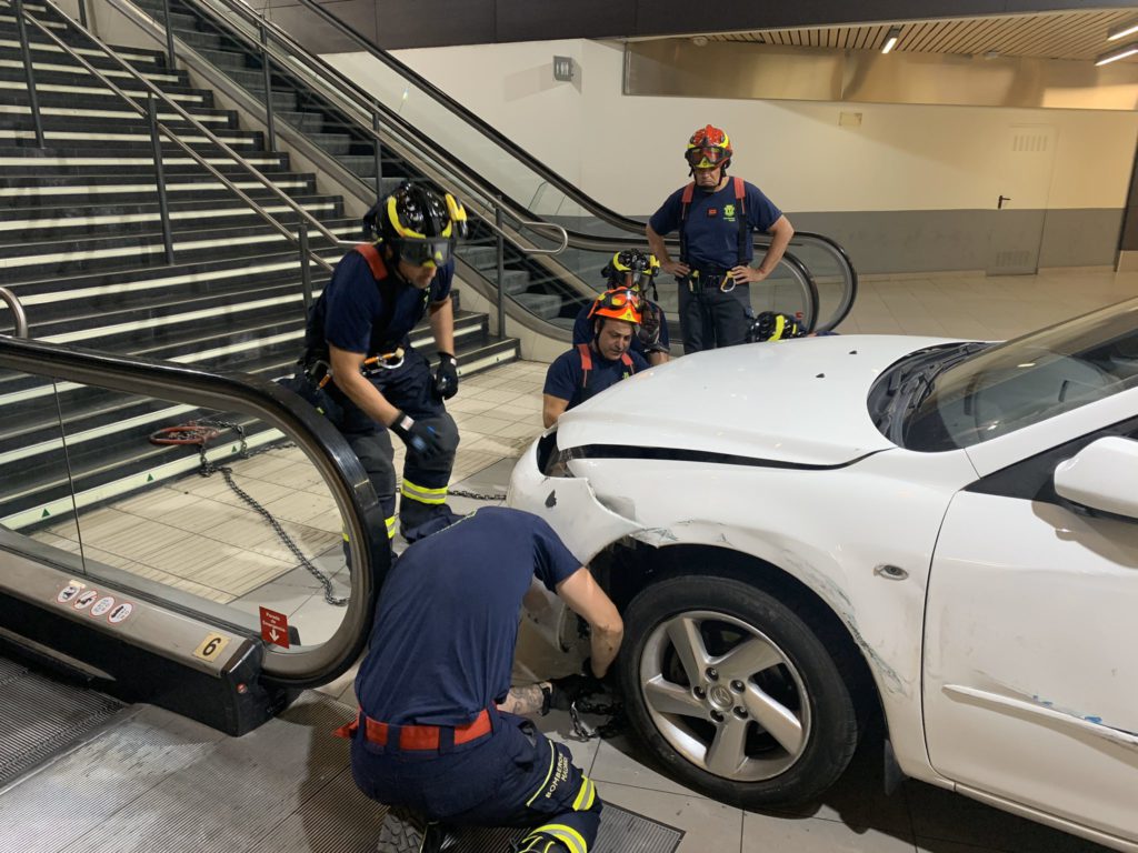 Car thief fleeing police gets the vehicle stuck on shopping centre stairs