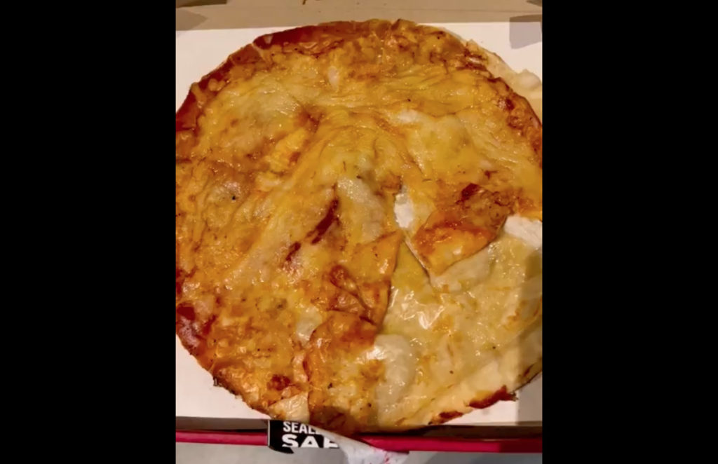 WATCH: Pizza chain offers apology after viral video shows 'plastic topping'