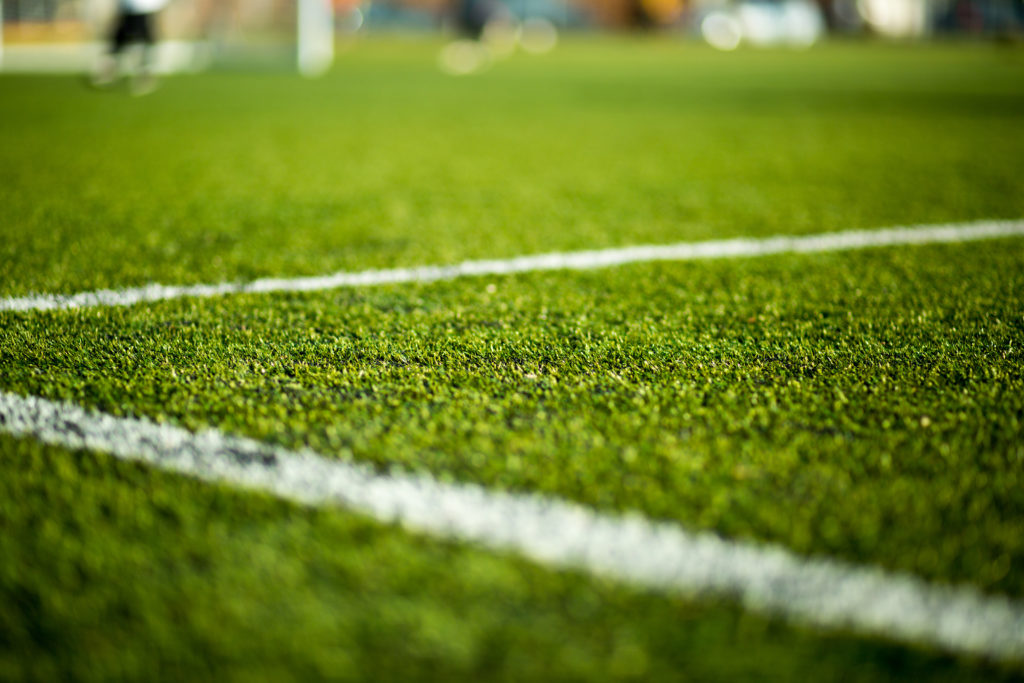 Women's football club denied league status due to playing on artificial pitch