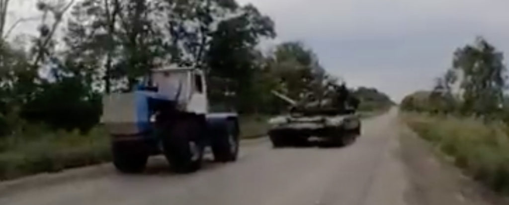 WATCH: Ukrainian tractor drivers move abandoned Russian T-72B3 tank