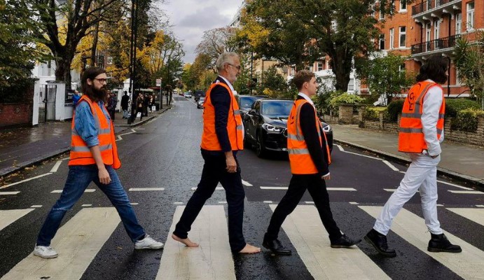 Just Stop Oil protesters arrested after glueing themselves to London's iconic Abbey Road zebra crossing