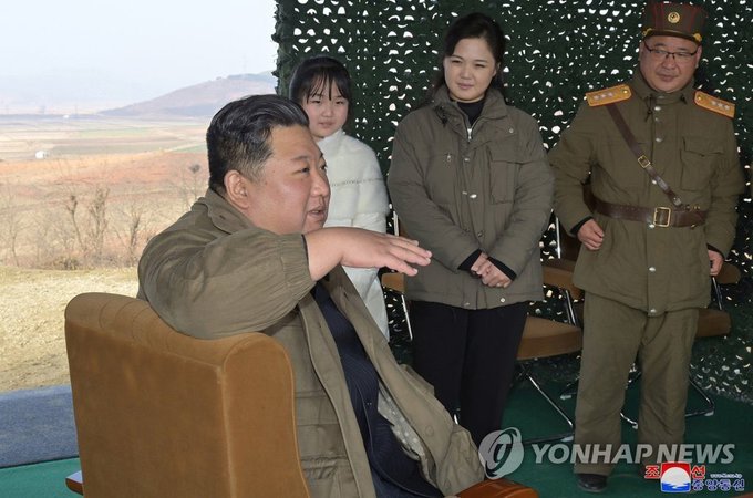 Kim Jong-un reveals daughter and possible heir at ballistic missile test