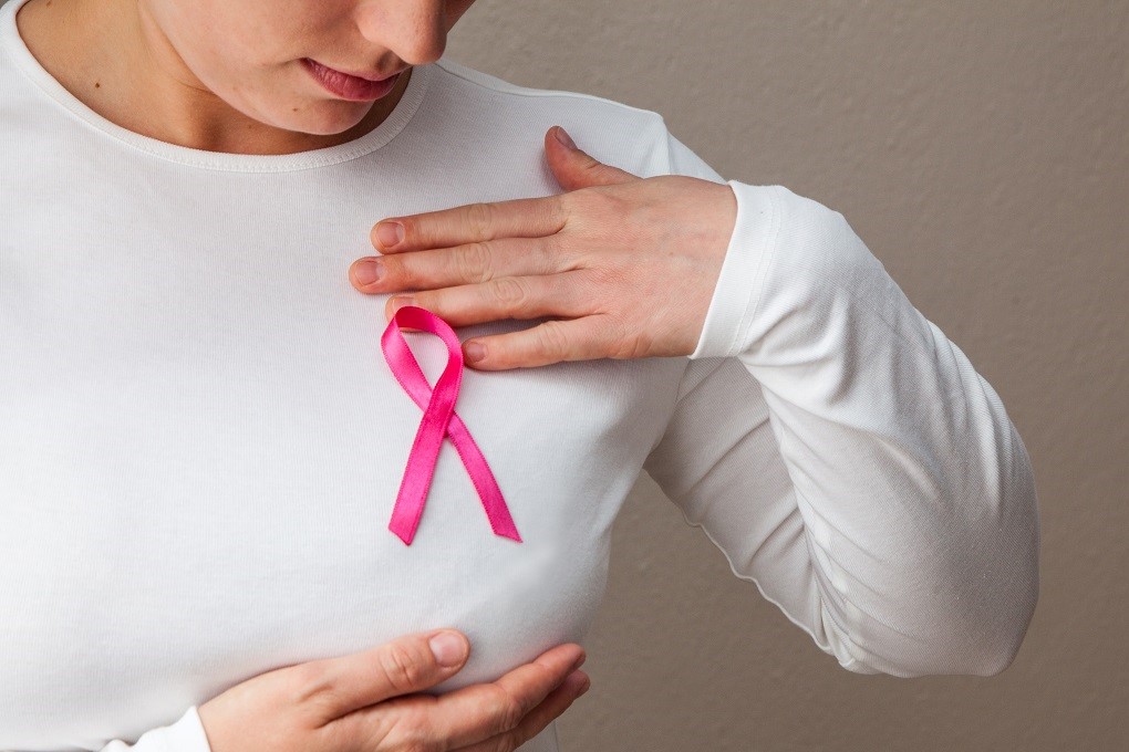 When should you see a doctor after a breast self-examination?