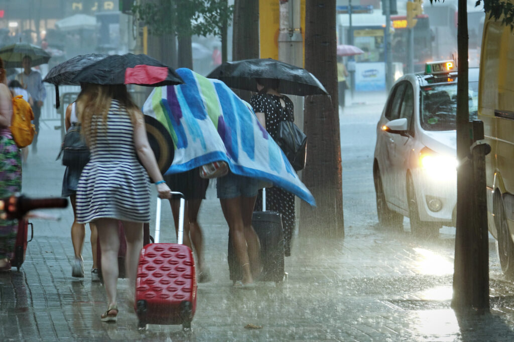 Image of people walking in the rain.