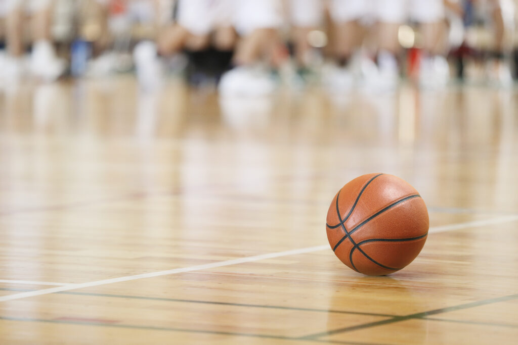 Image of a basketball on a court.