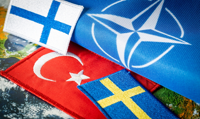 Image of NATO, Swedish, Finnish and Turkish flags.