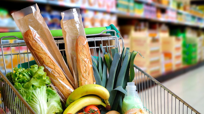 Image of food products in a supermarket trolley.