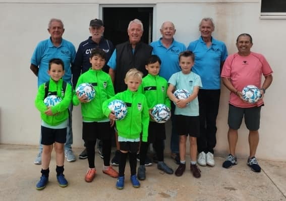 Hondon Valley Walking Football Club donate footballs to the junior team to say thank you.