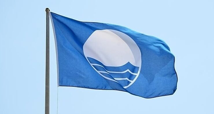 a blue flag for beach quality flying