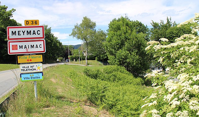 road signs on the entrance to Meymac in France