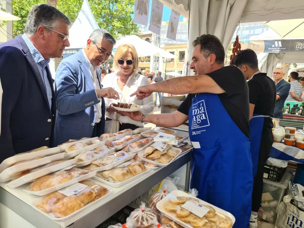 authorities try local specialties at food fair in nerja