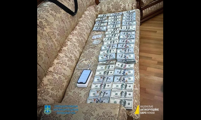Image of cash discovered in suspected bribery case in Ukraine.
