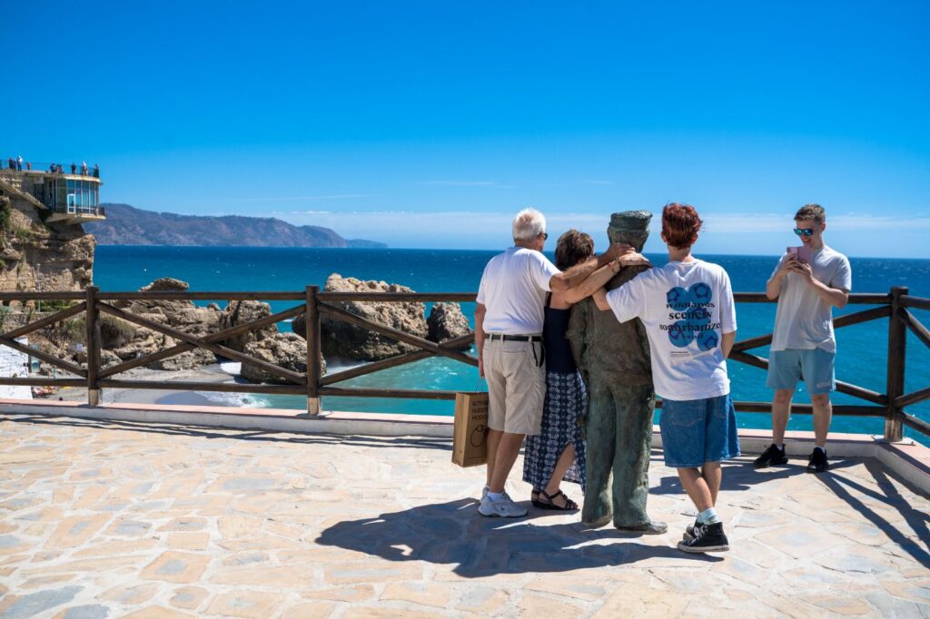 tourists pose for a picture in Nerja