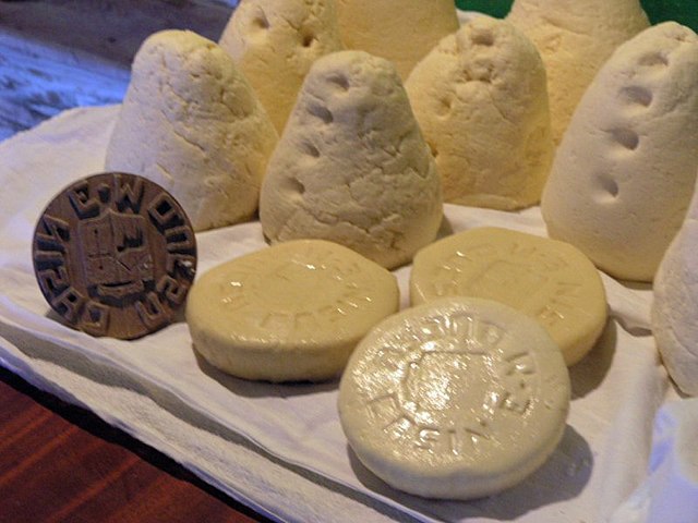 Various shapes and sizes of stamped Casín cheese