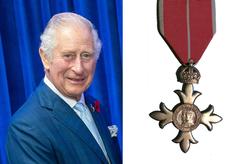 King Charles III and an MBE medal