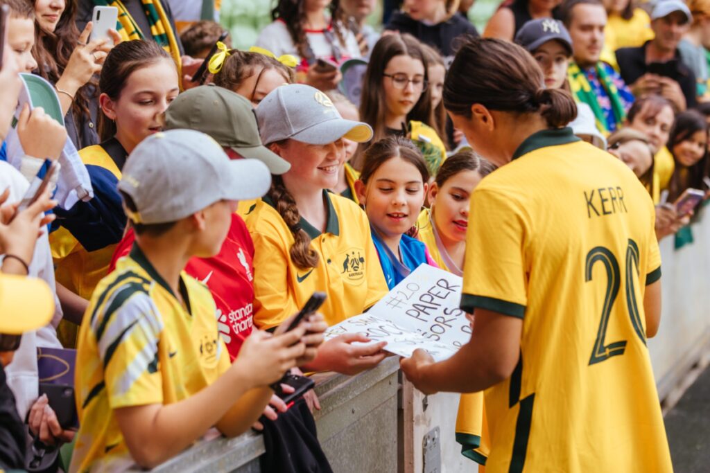 Australia Women football star Sam Kerr signing autographs.