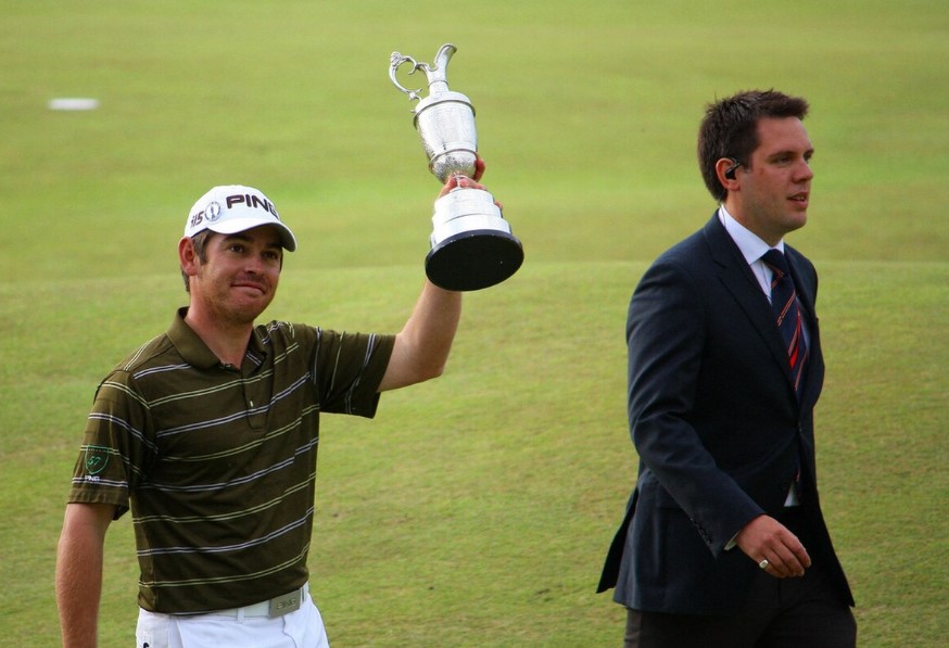 Image of Louis Oosthuizen holding the British Open Claret Jug in 2010.