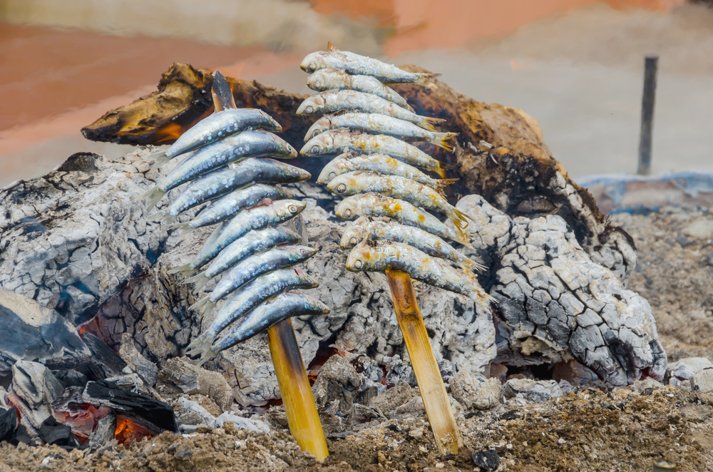 Image of sardines cooking at the beach in Spain.