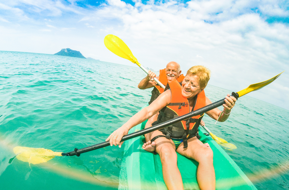 two older people kayaking