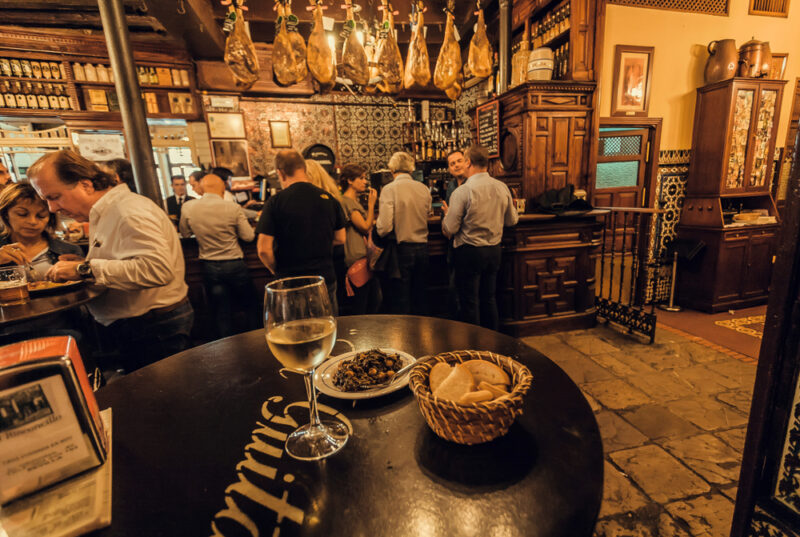 people in sevilla traditional bar