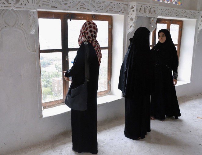 Image of Muslim women wearing traditional abayas.